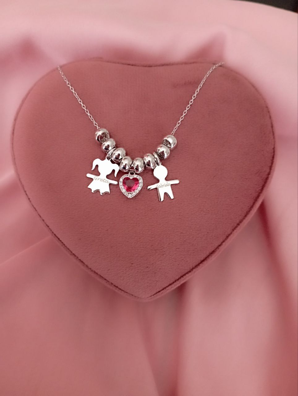 Collana con due bimbi lisci, cuore centrale e ciambelline - argento 925