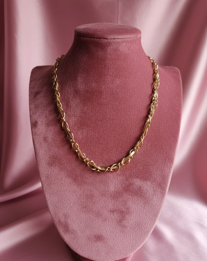 Collana snake intrecciato in una catena oro
