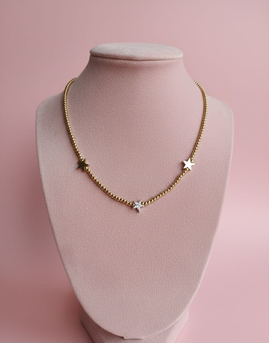 Collana con perline e tre stelle oro