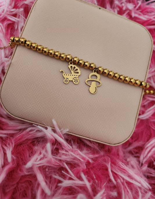 Bracciale perline con due charm baby gold