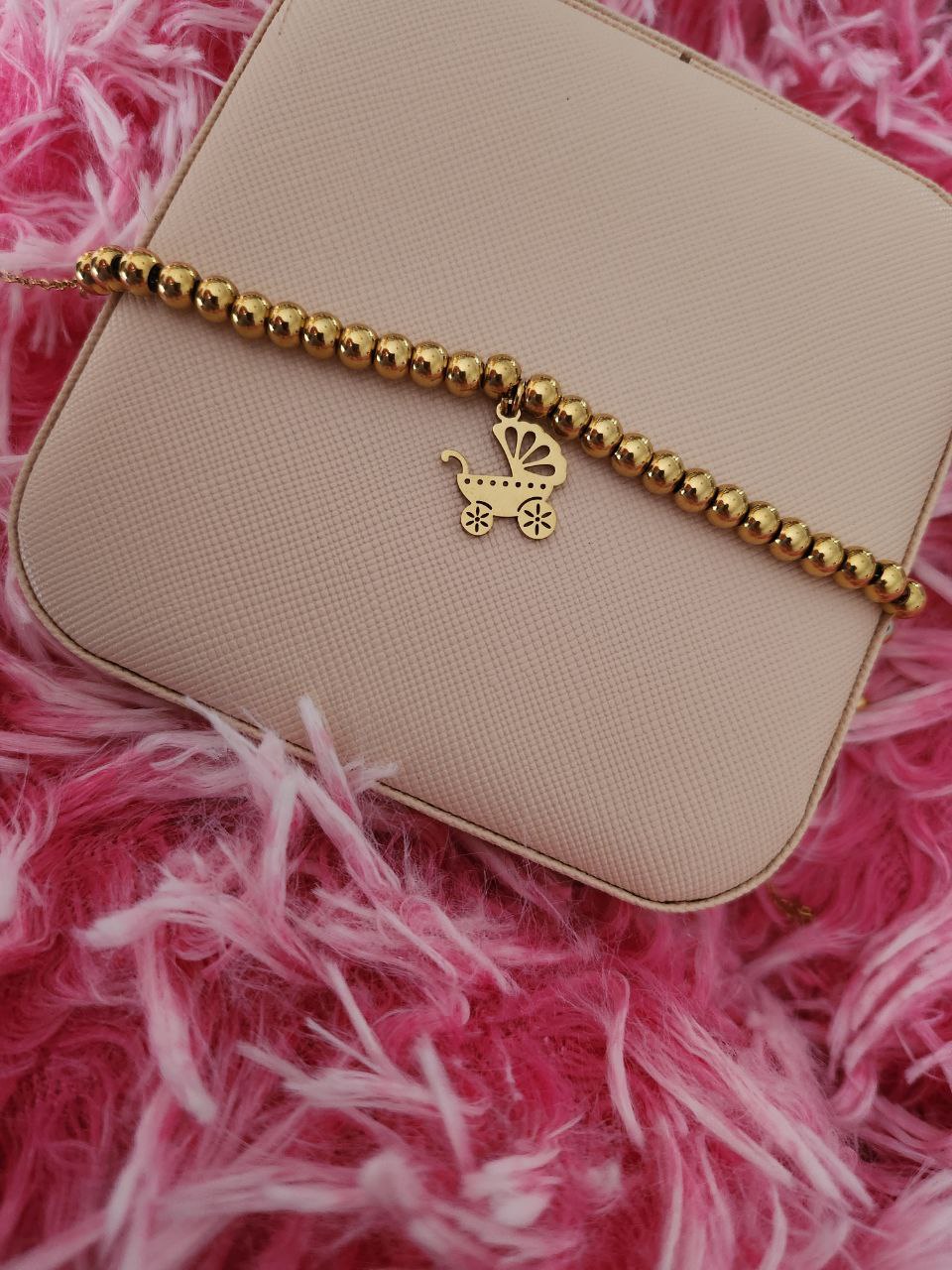 Bracciale perline con passeggino  gold