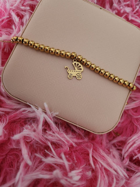 Bracciale perline con passeggino  gold