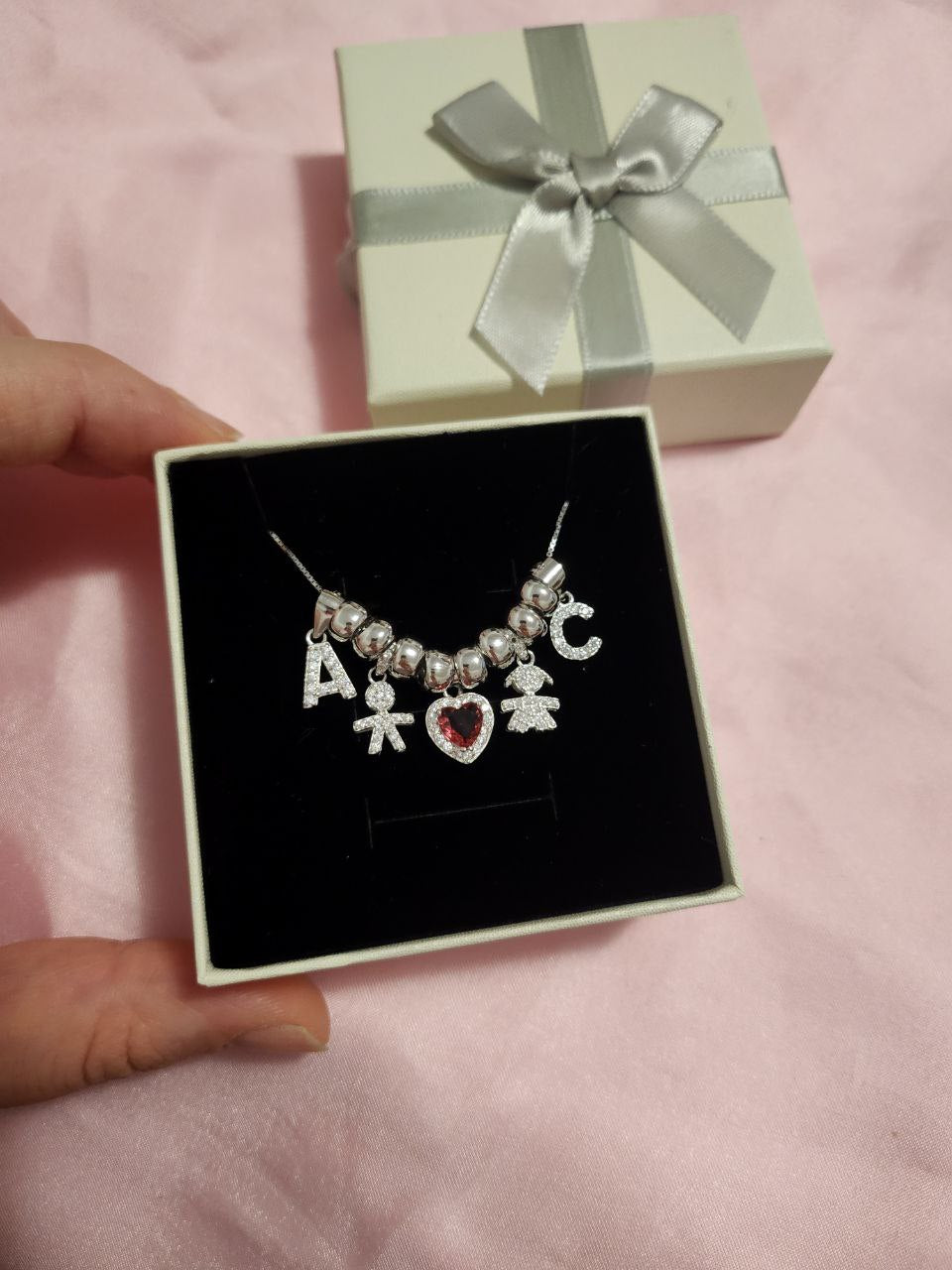 Collana con due bimbi e due lettere con ciambelline- argento 925