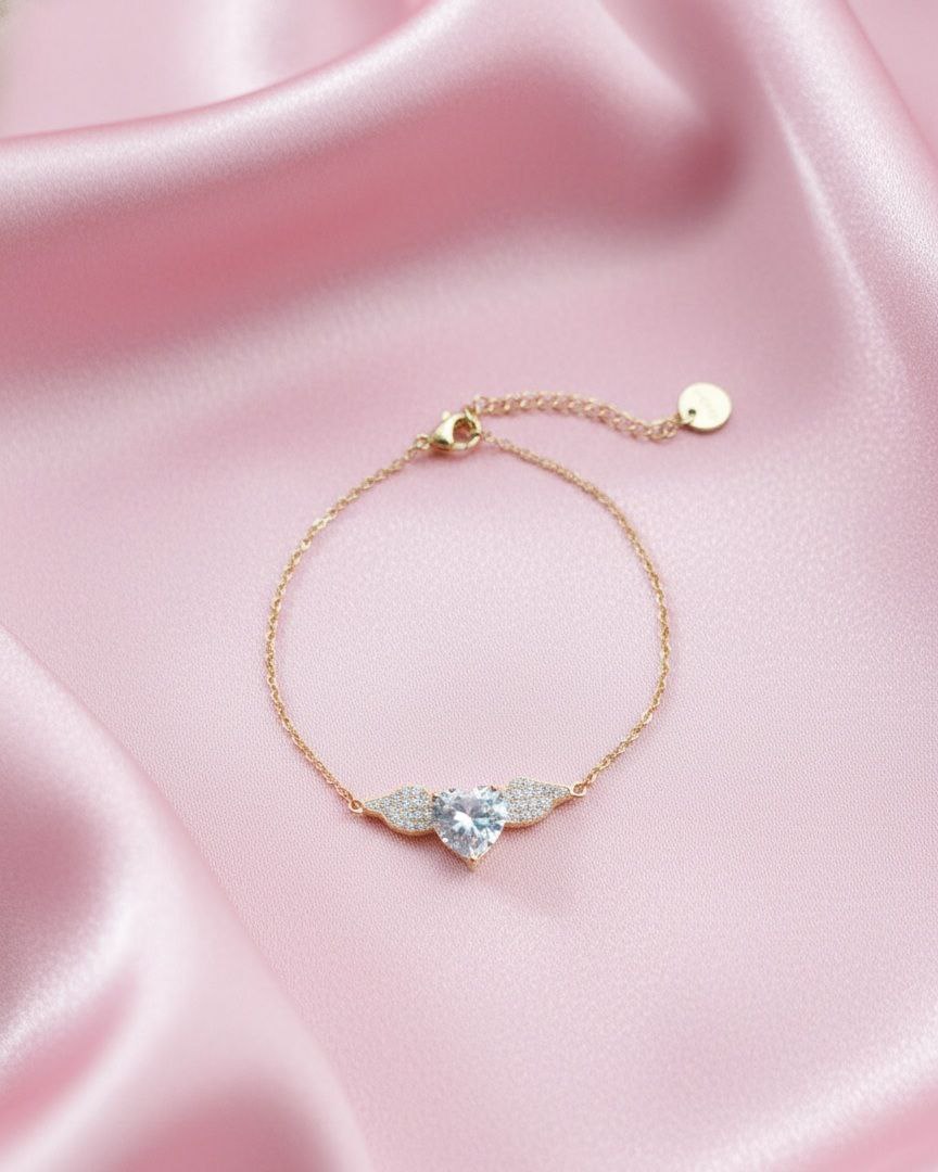 Bracciale cuore con ali gold