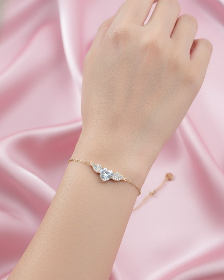 Bracciale cuore con ali gold